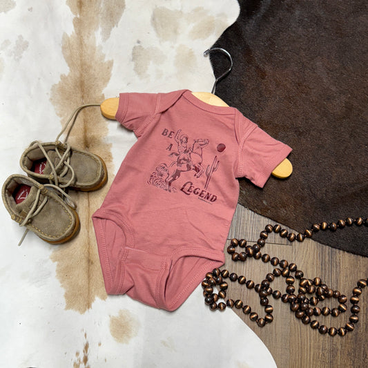 Pink mauve onesie with red colored cowgirl outline