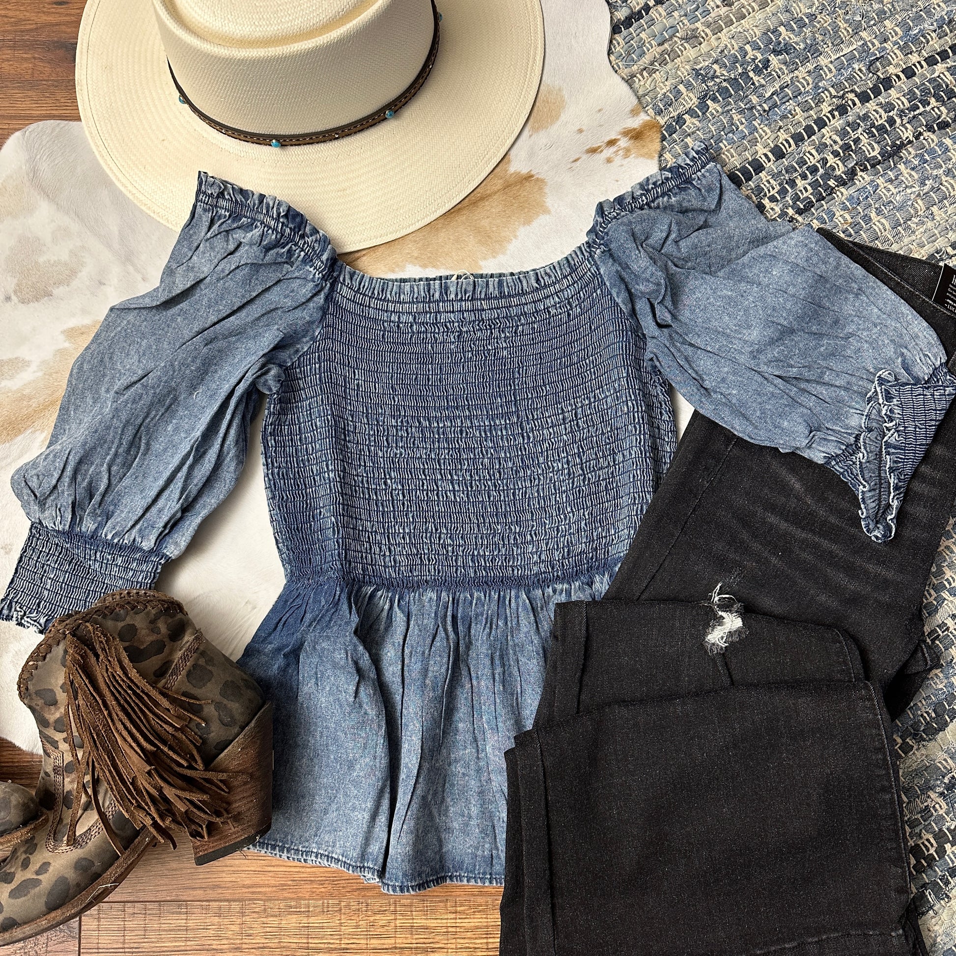 Acid washed smocked denim top, off shoulder.