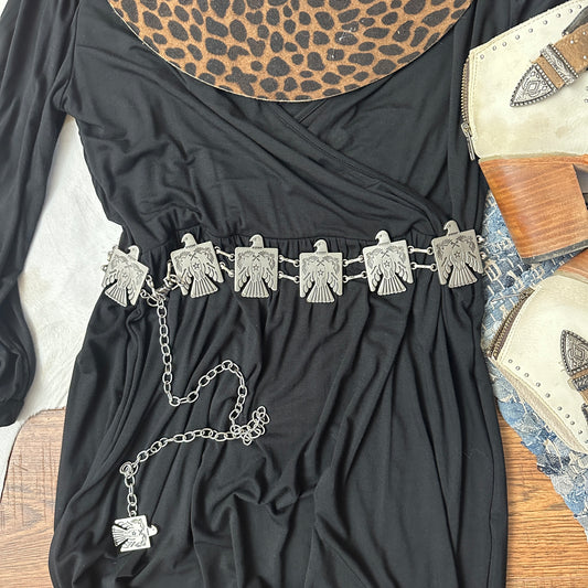 Silver metal thunderbird chain hip belt.