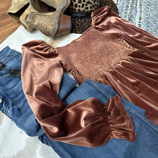 Close up of smocking and sleeves on the top.