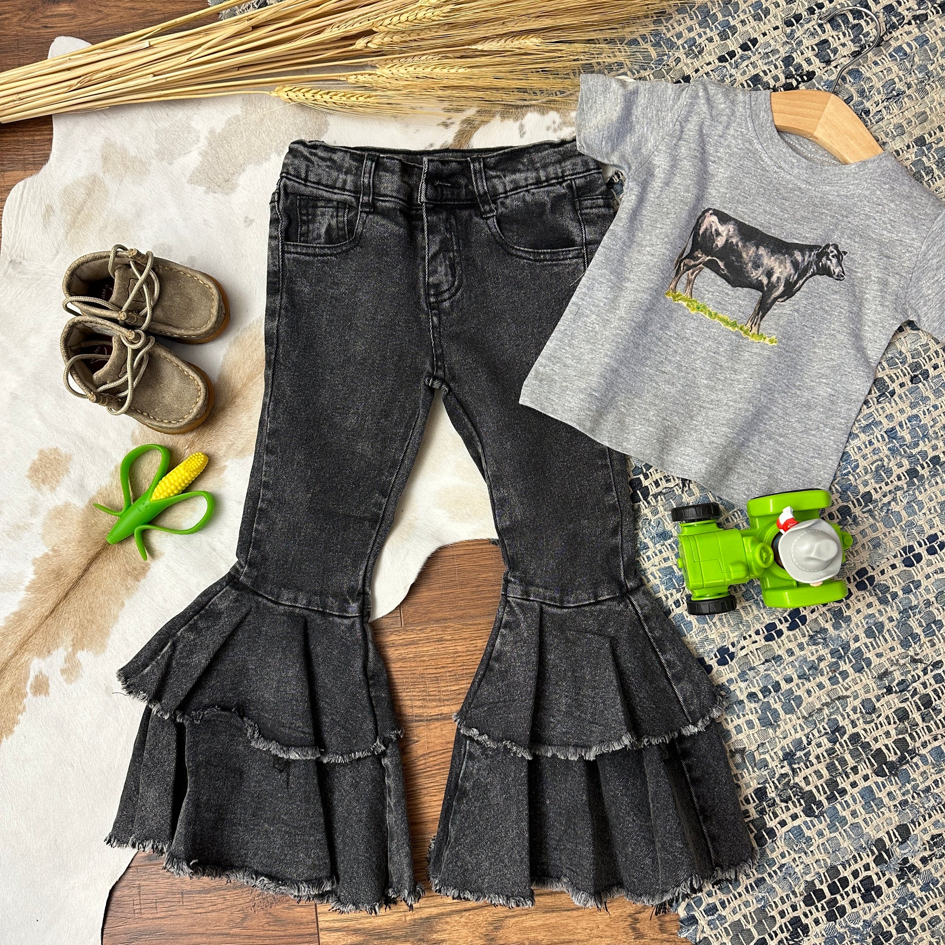 Black denim double bells with raw hem.