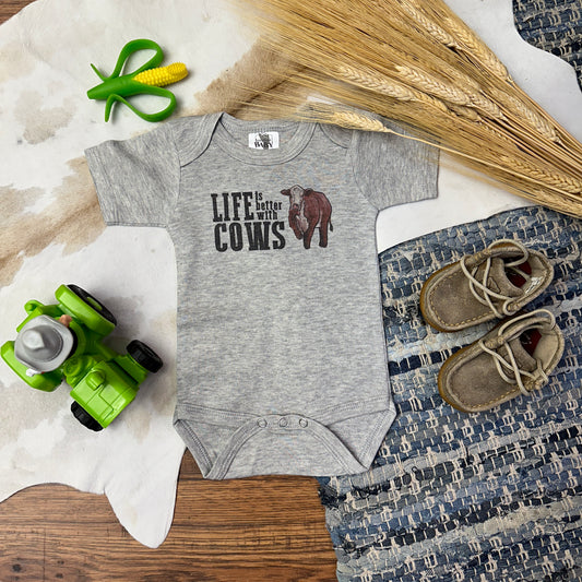 Gray bodysuit that says Life is better with cows