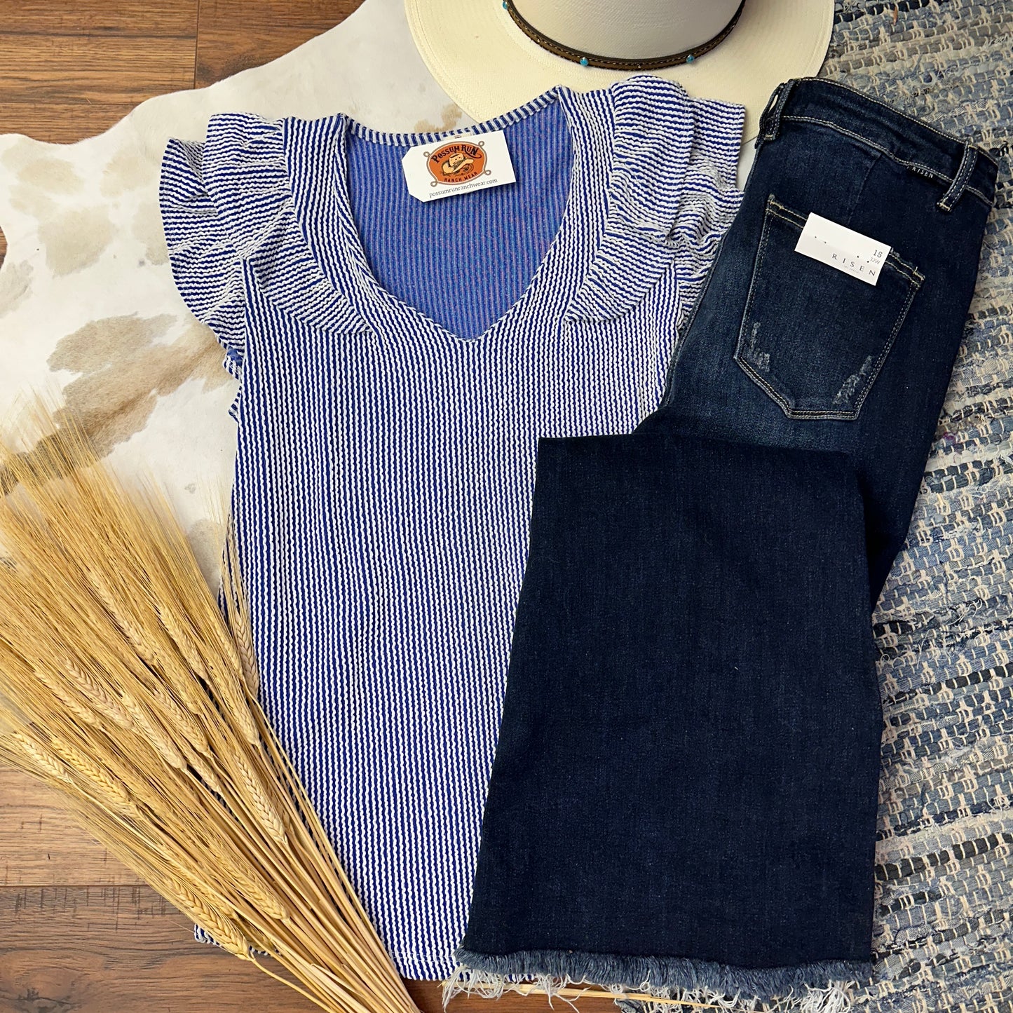 pintriped blue and white top with ruffle sleeves and a v neckline