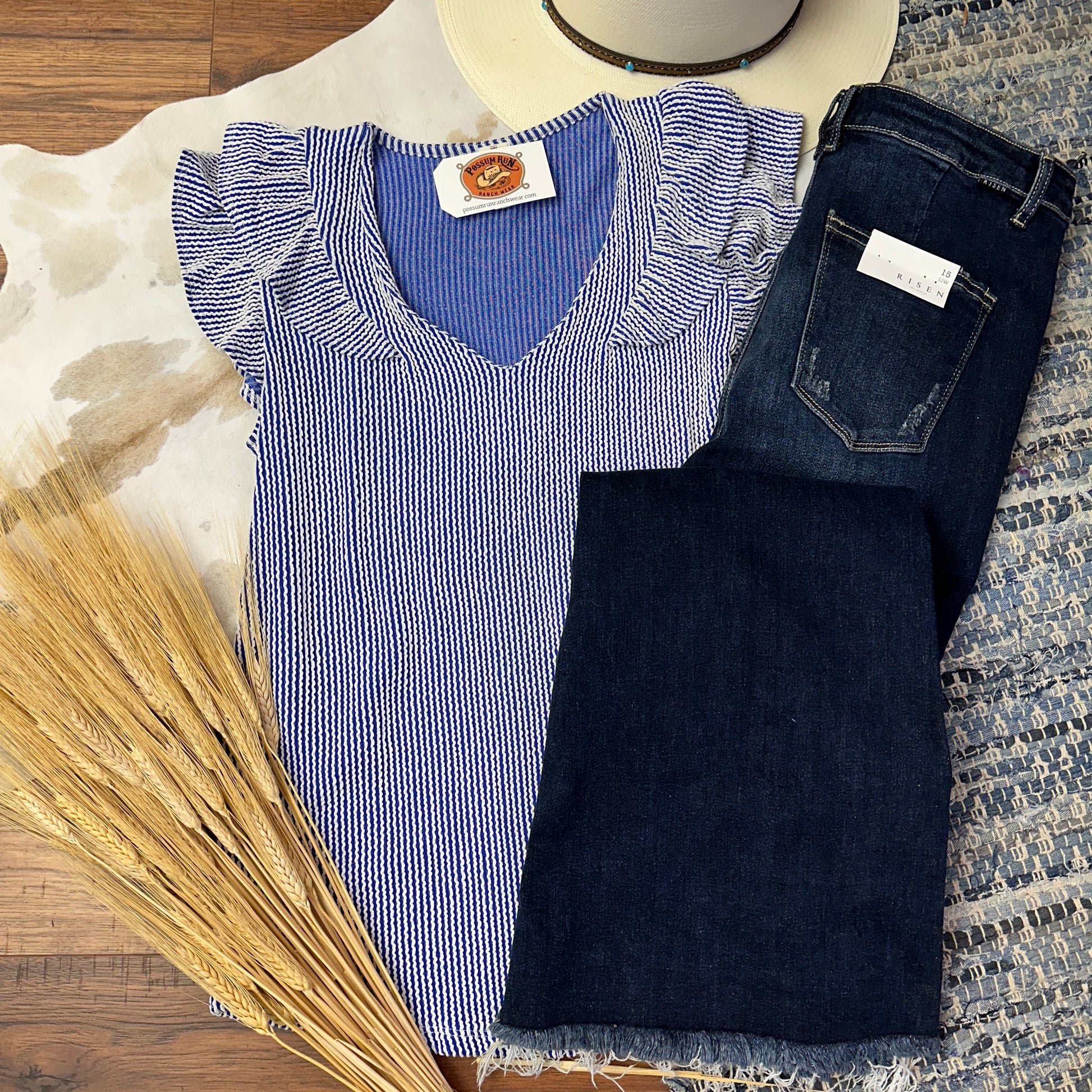 pintriped blue and white top with ruffle sleeves and a v neckline