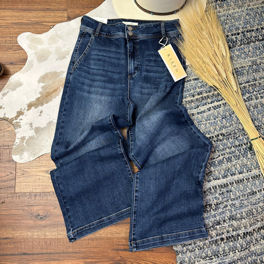 Dark wash wide legged denim.