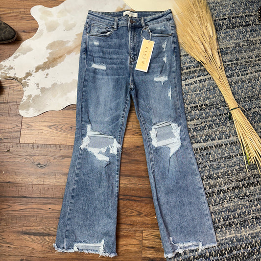 Medium Wash destroyed ankle crop flares.