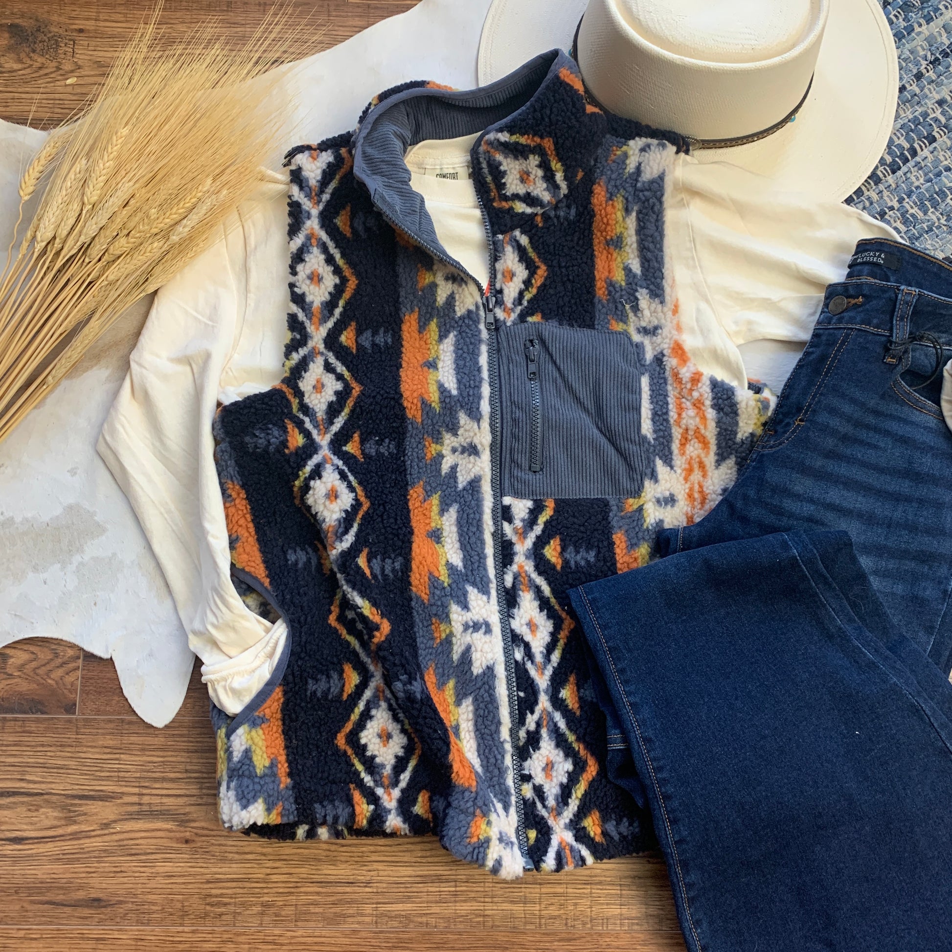 southwestern aztec sherpa vest with breast pocket and two side pockets.