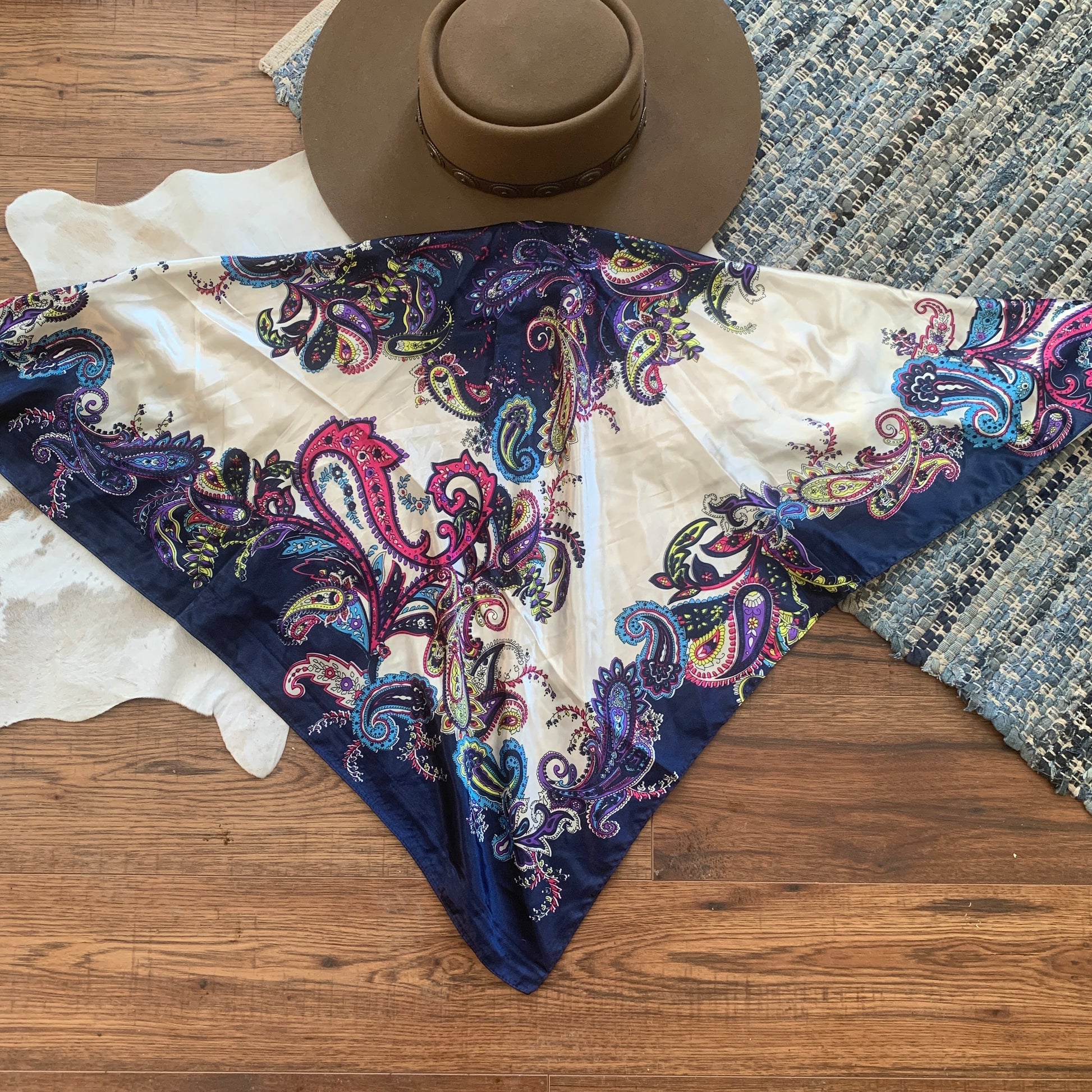 White with bright prints of paisley on a navy background.