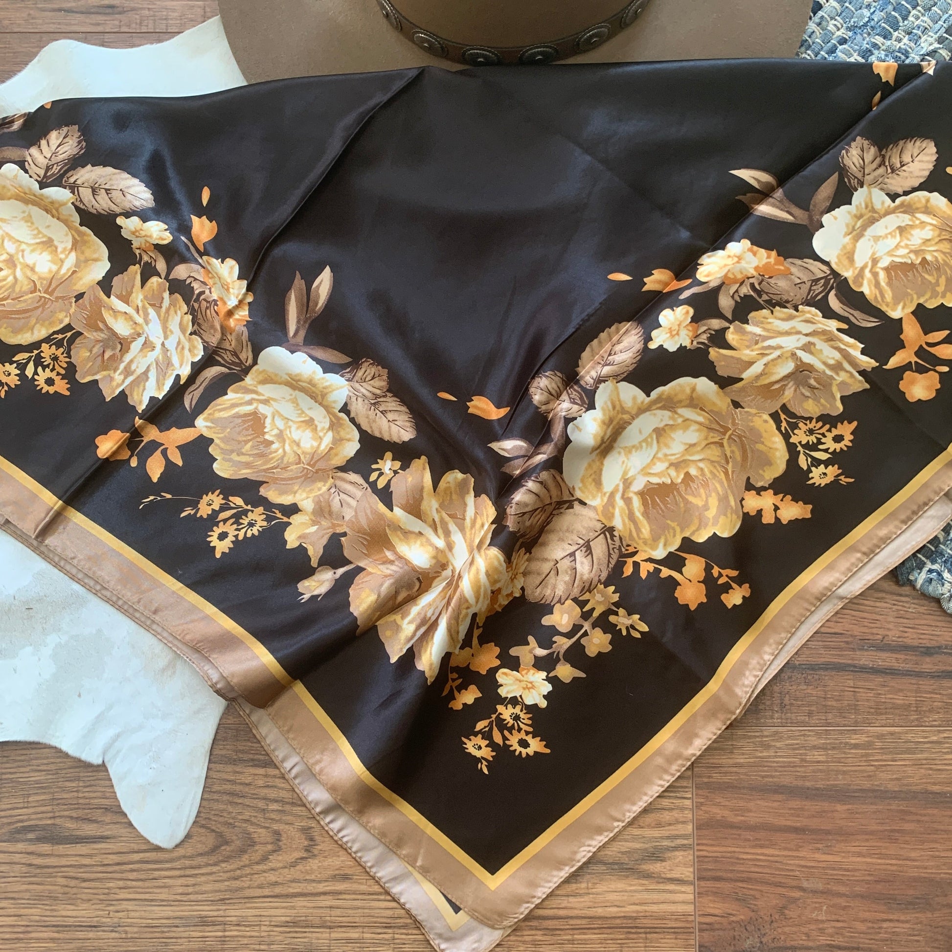 Black with golden roses and a tan border.