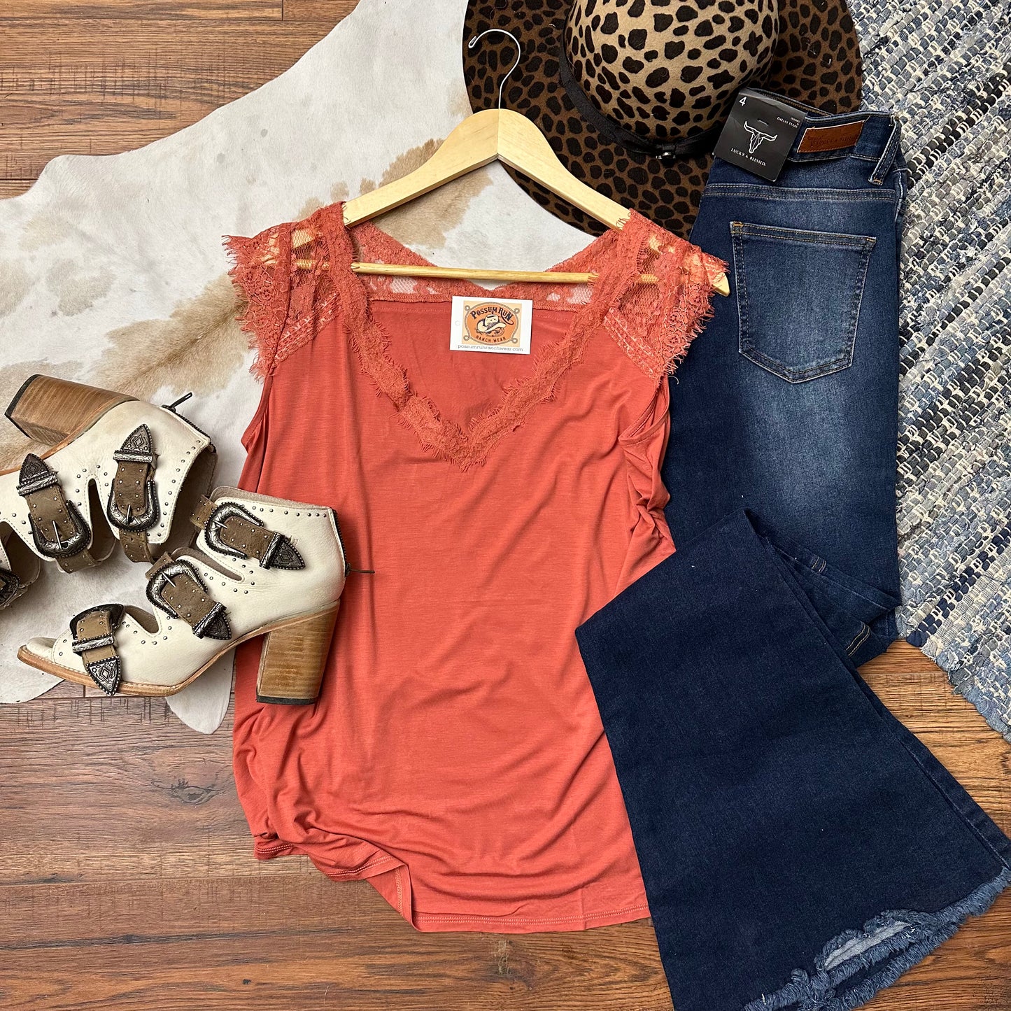 Dark marsala pink tank top with lace trim and shoulder caps.