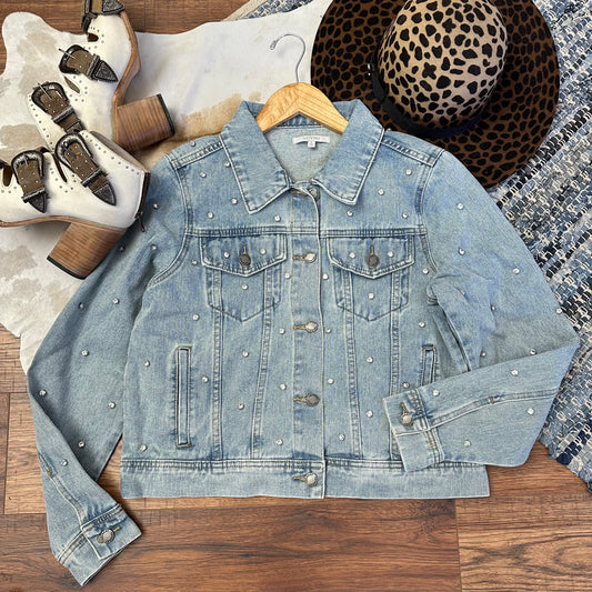 Light denim wash jacket with rhinestones embellishment.