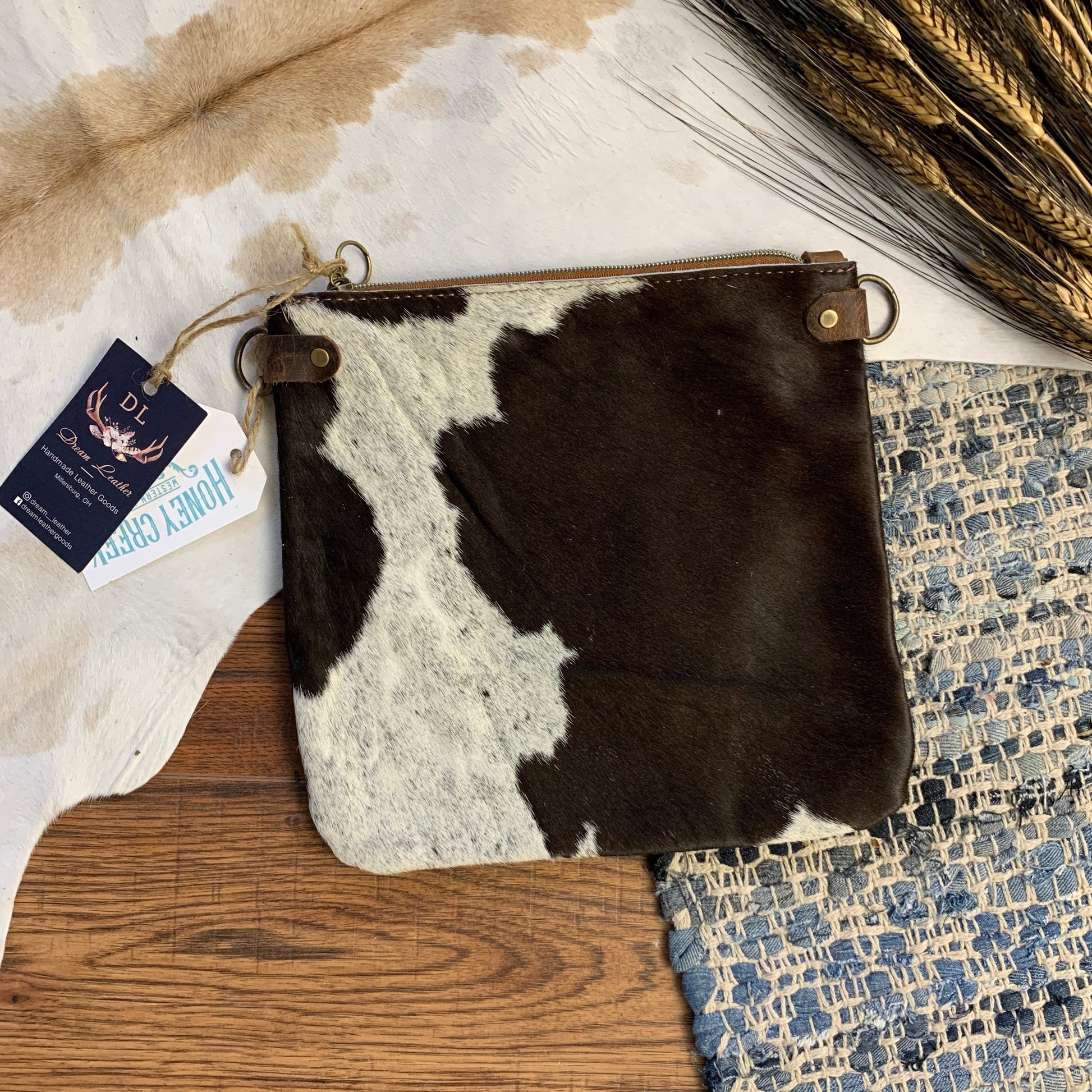 Brown and White Spot Hair on hide medium pouch.