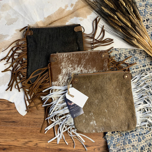 medium hair on hide pouches with fringe.
