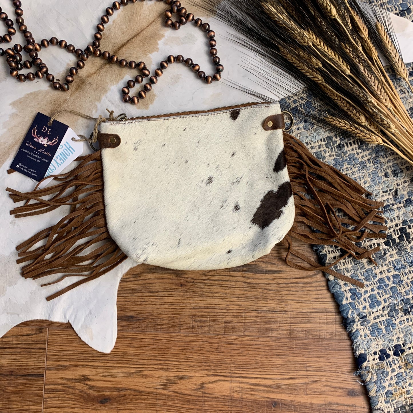 White with small brown speckles and brown side fringe.