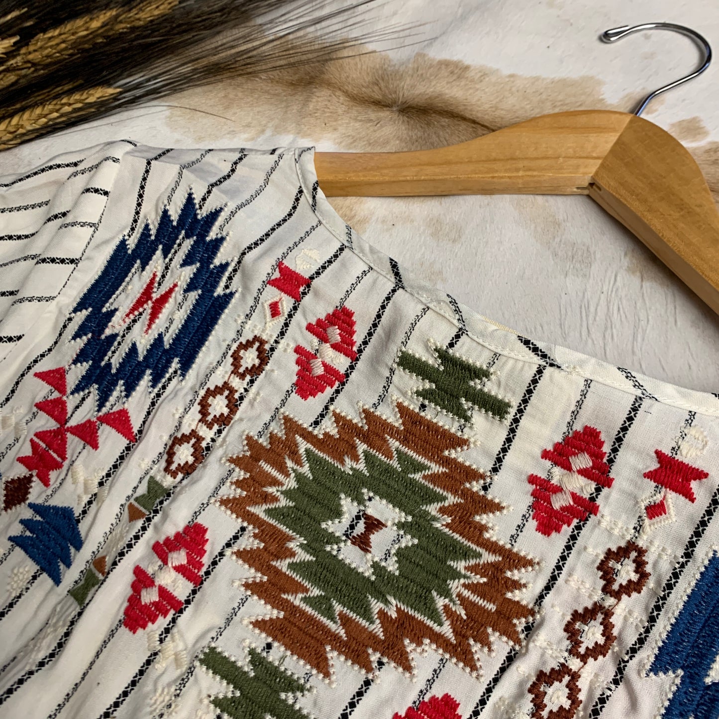 Close up of aztec embroidery.