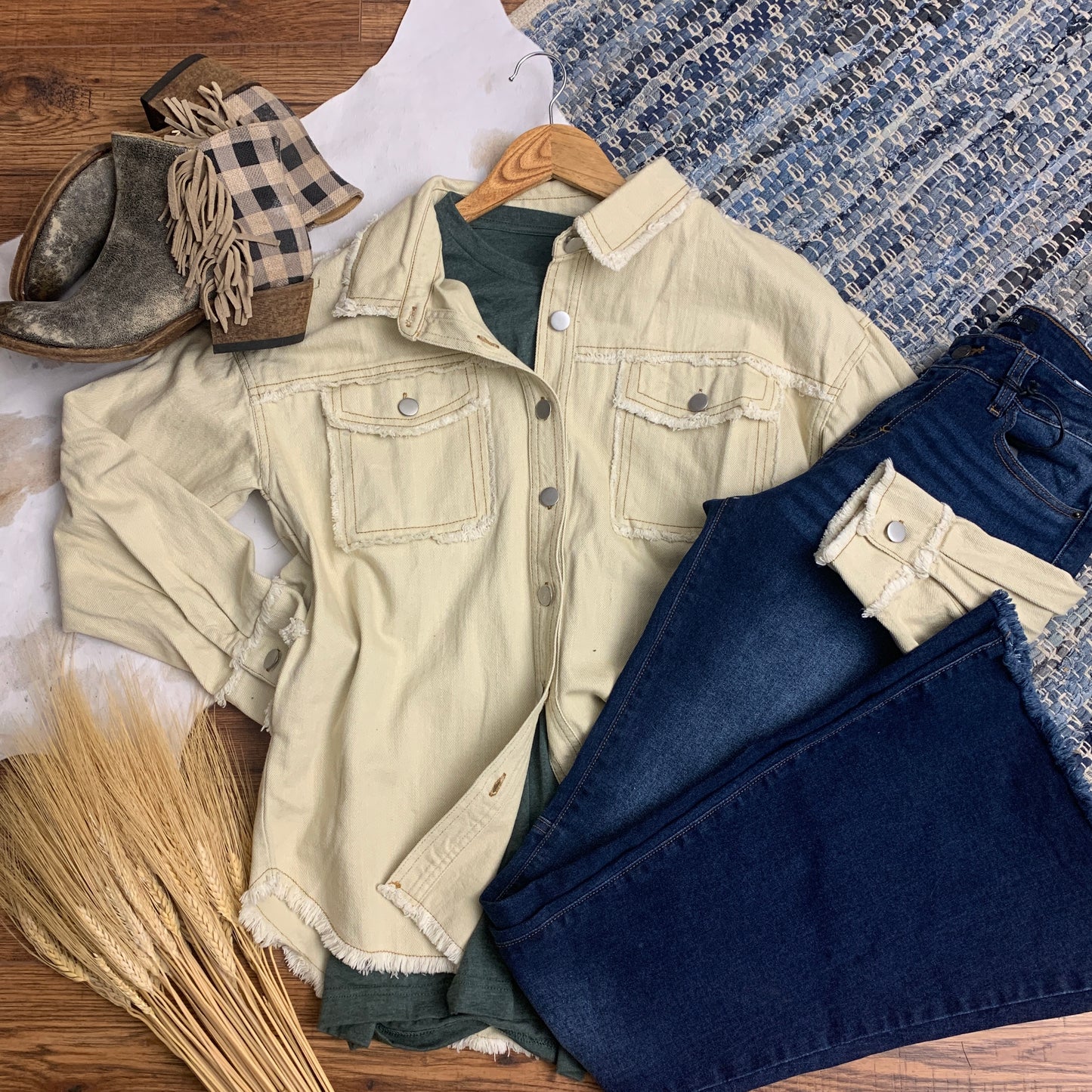 100% cotton, cream denim with frayed edges, breast pockets, hidden side pockets and nickel plated buttons.