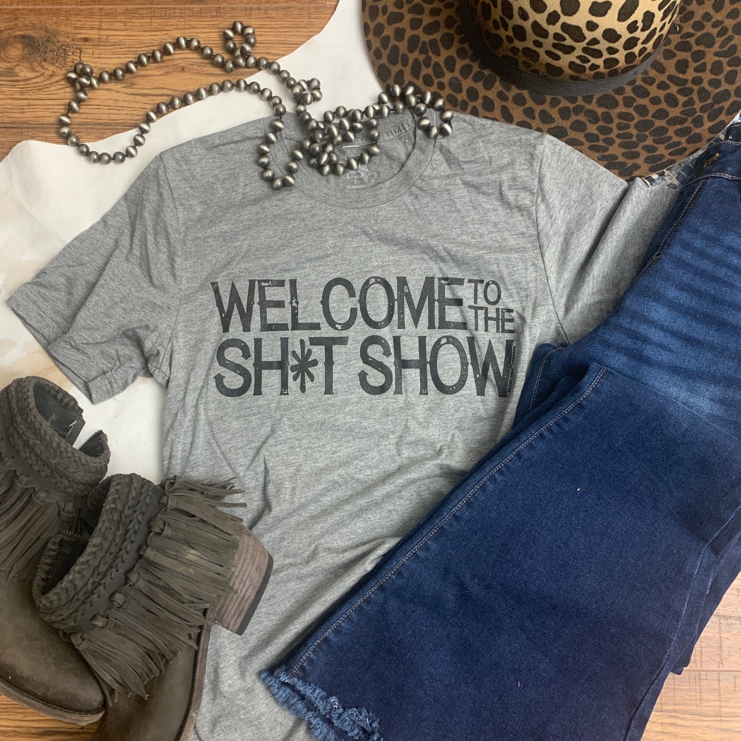 Gray tri blend graphic tee with black lettering.