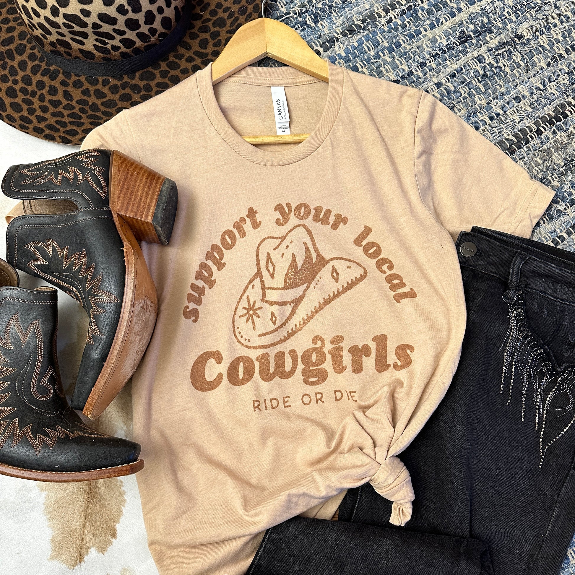 Support your local cowgirls on a tan shirt.