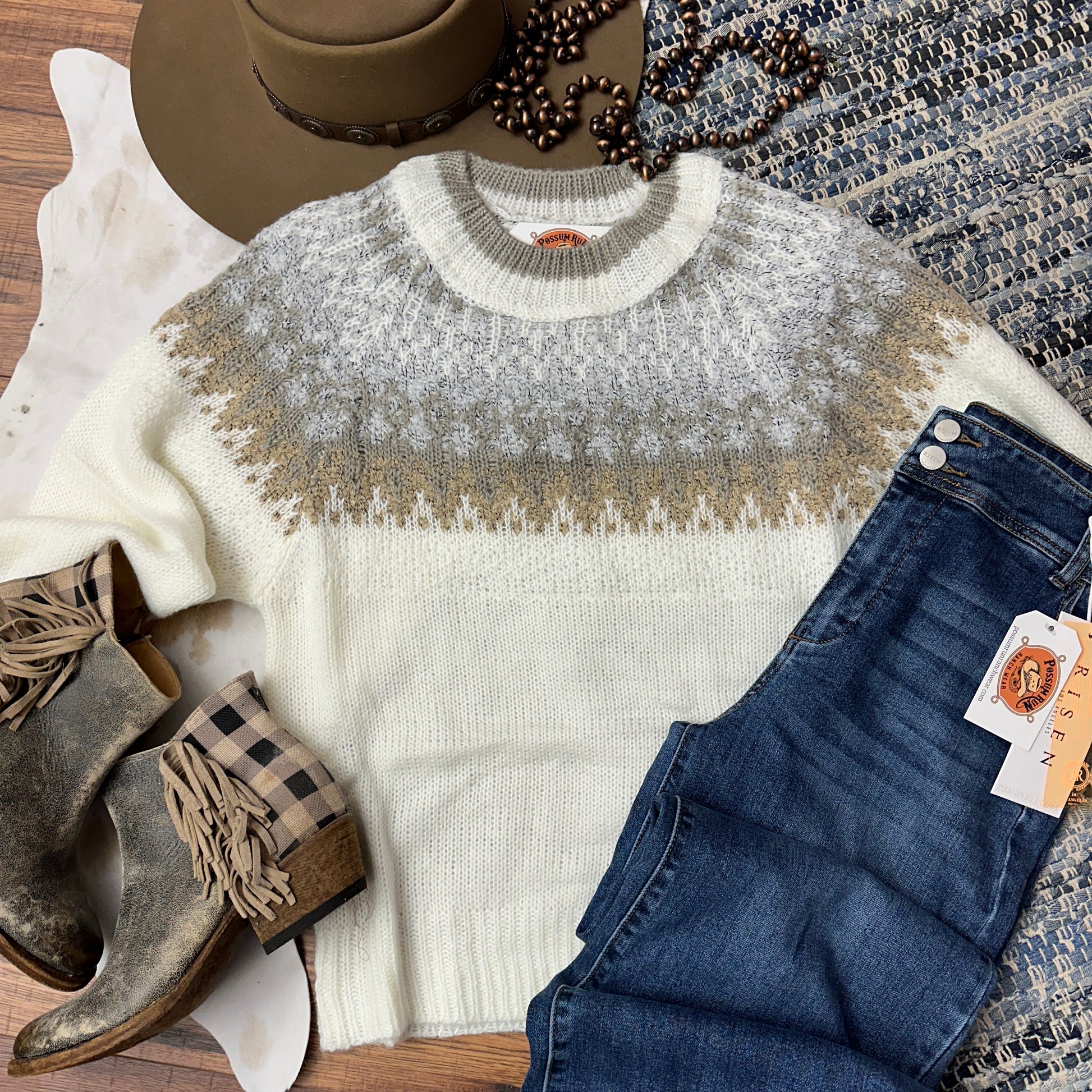 Cream knit sweater with neutral faireisle yoke.