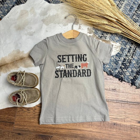 Gray children's shirt that says Setting the Standard with animal shilouettes.