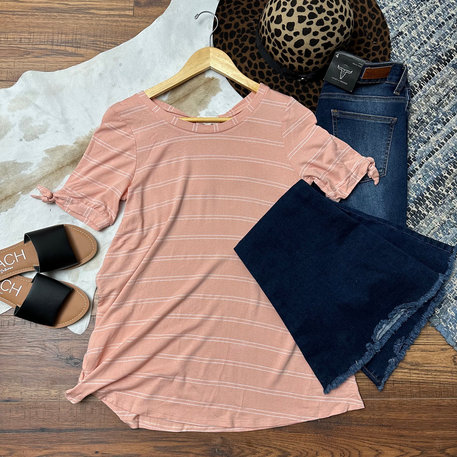 peach pinstriped top.