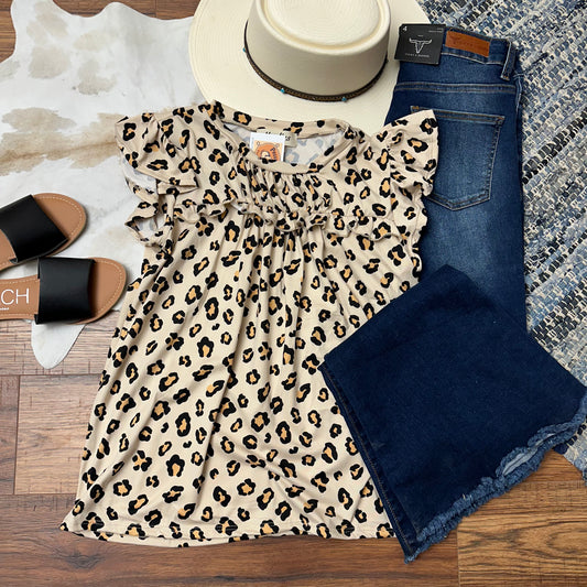 animal print short sleeve top with ruffle and flutter sleeves.