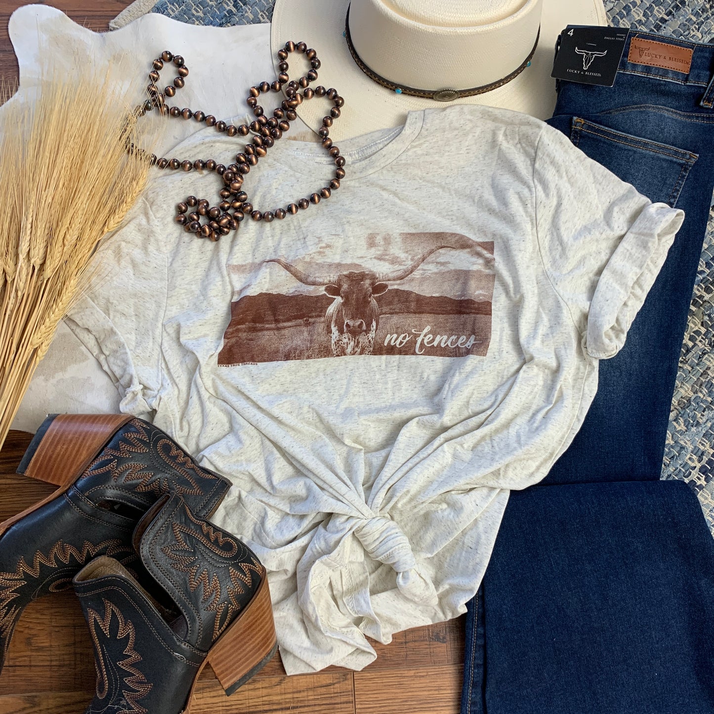 light heather colored tee with a picture of a longhorn.