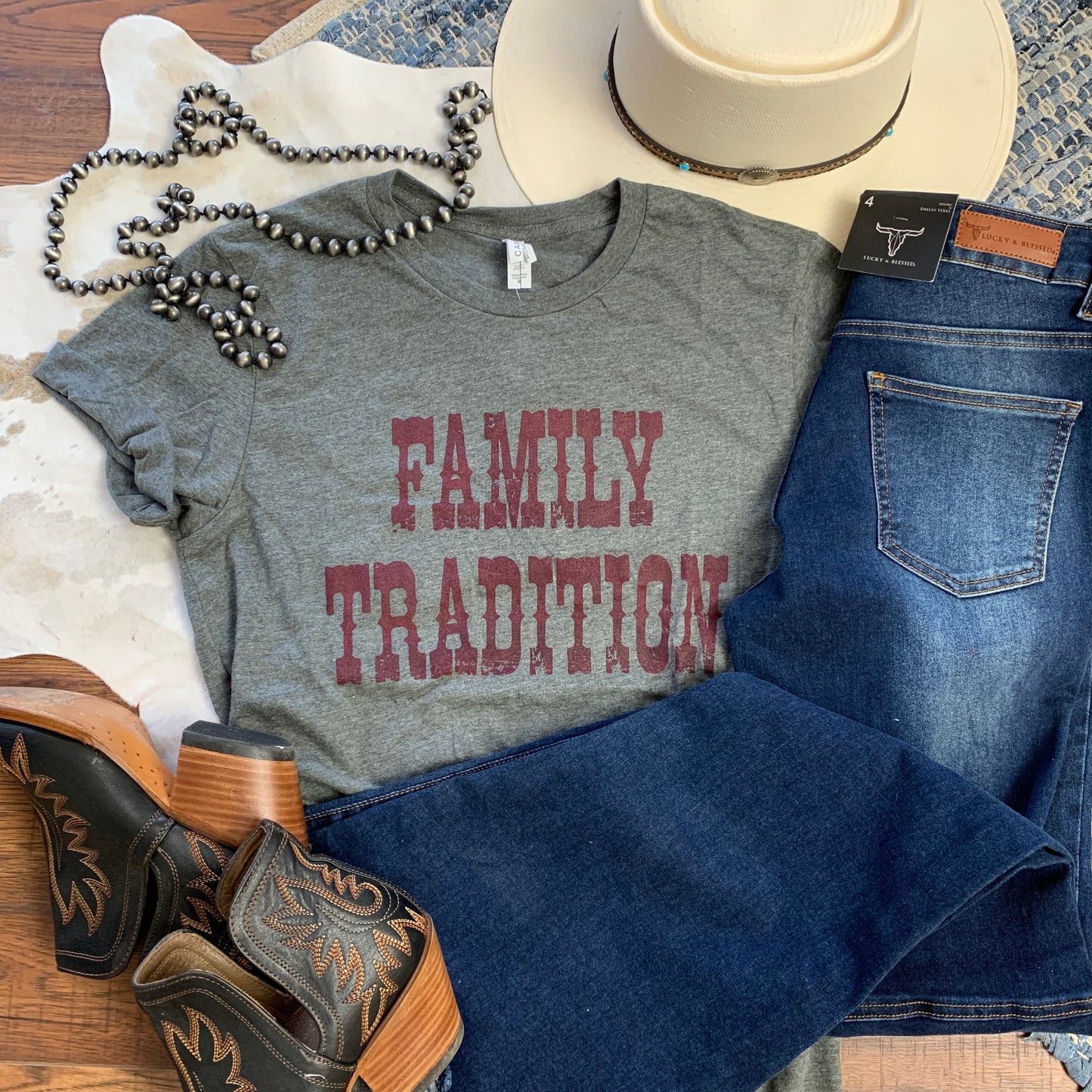 gray shirt with Family Tradition printed in maroon.