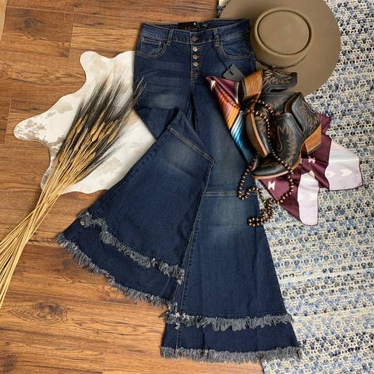 dark wash flare jeans, with button fly and double frayed hemline.