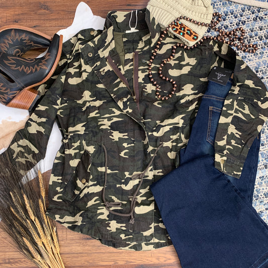 camo utility jacket paired with jeans.