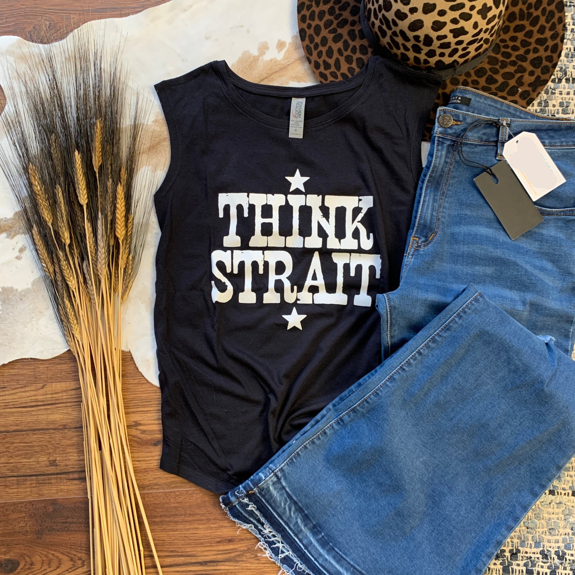 black muscle tank that says Think Strait in white lettering