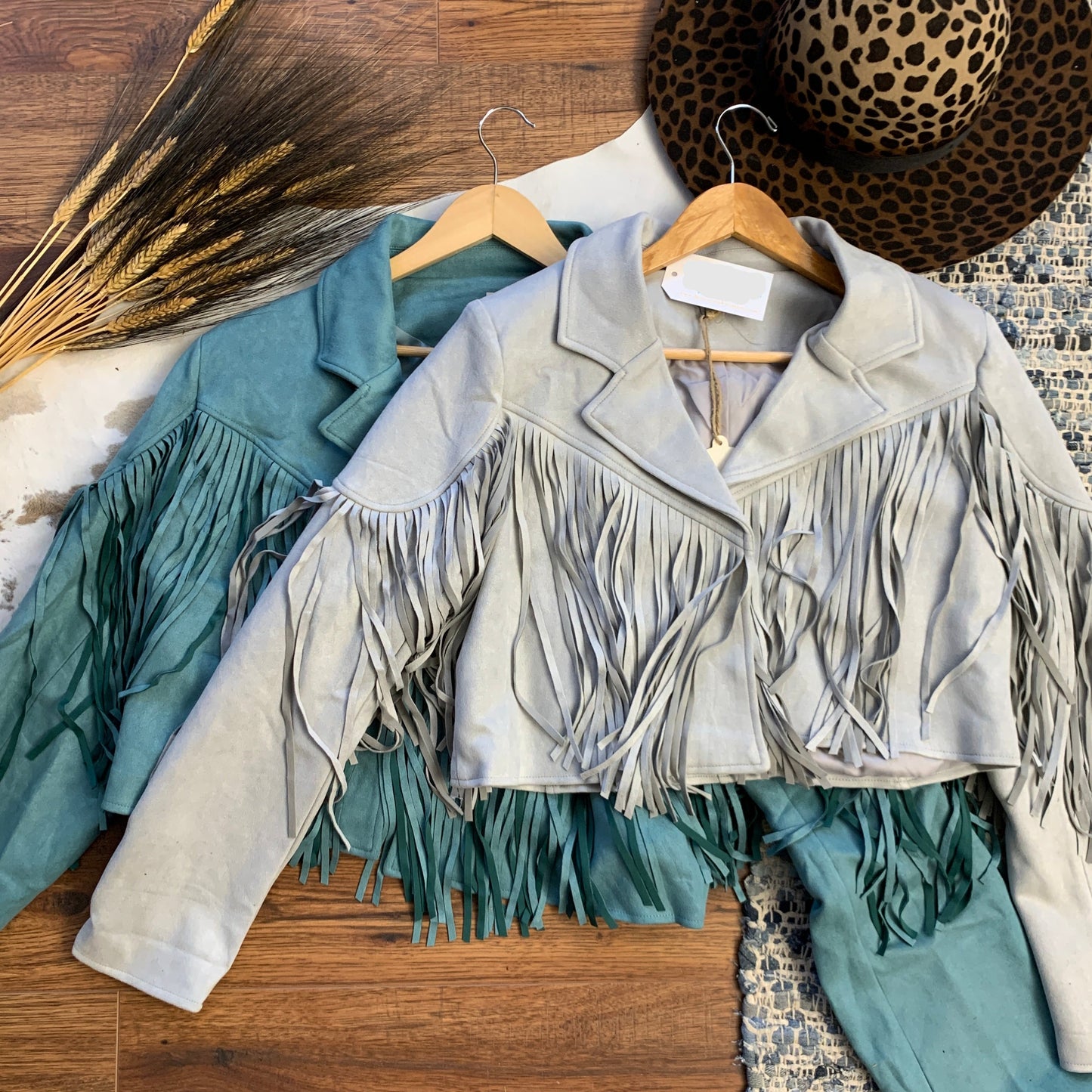 fringe jackets, one gray, one turquoise