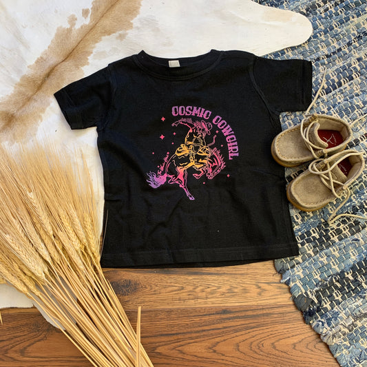 Black childrens tee with rainbow cosmic cowgirl printed.